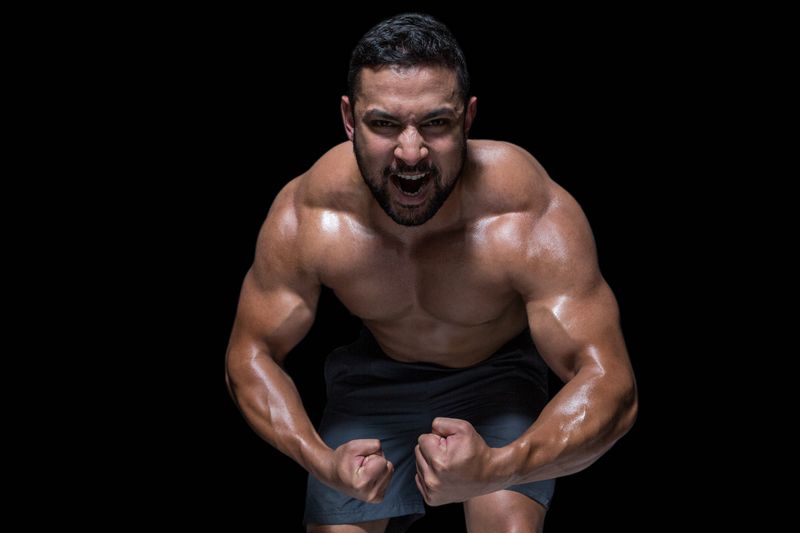 Athletic man on black background
