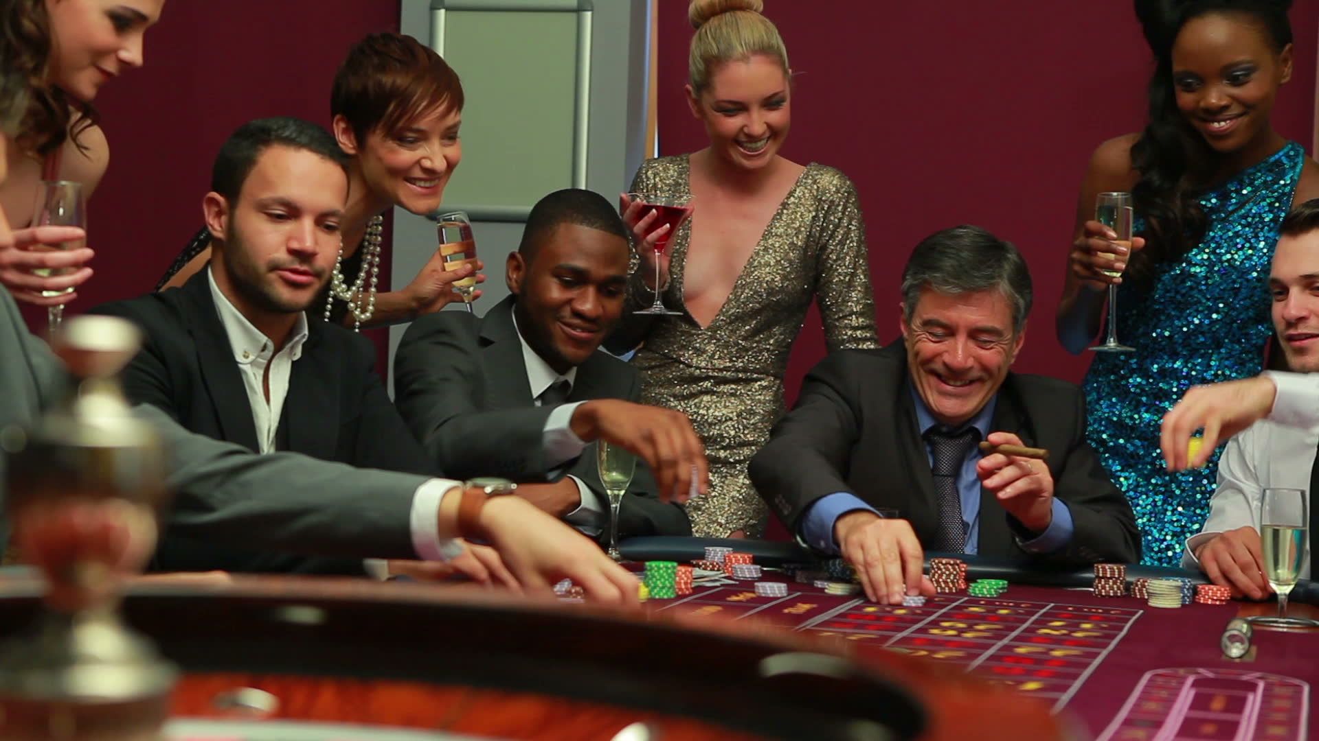Group of people playing roulette at a casino